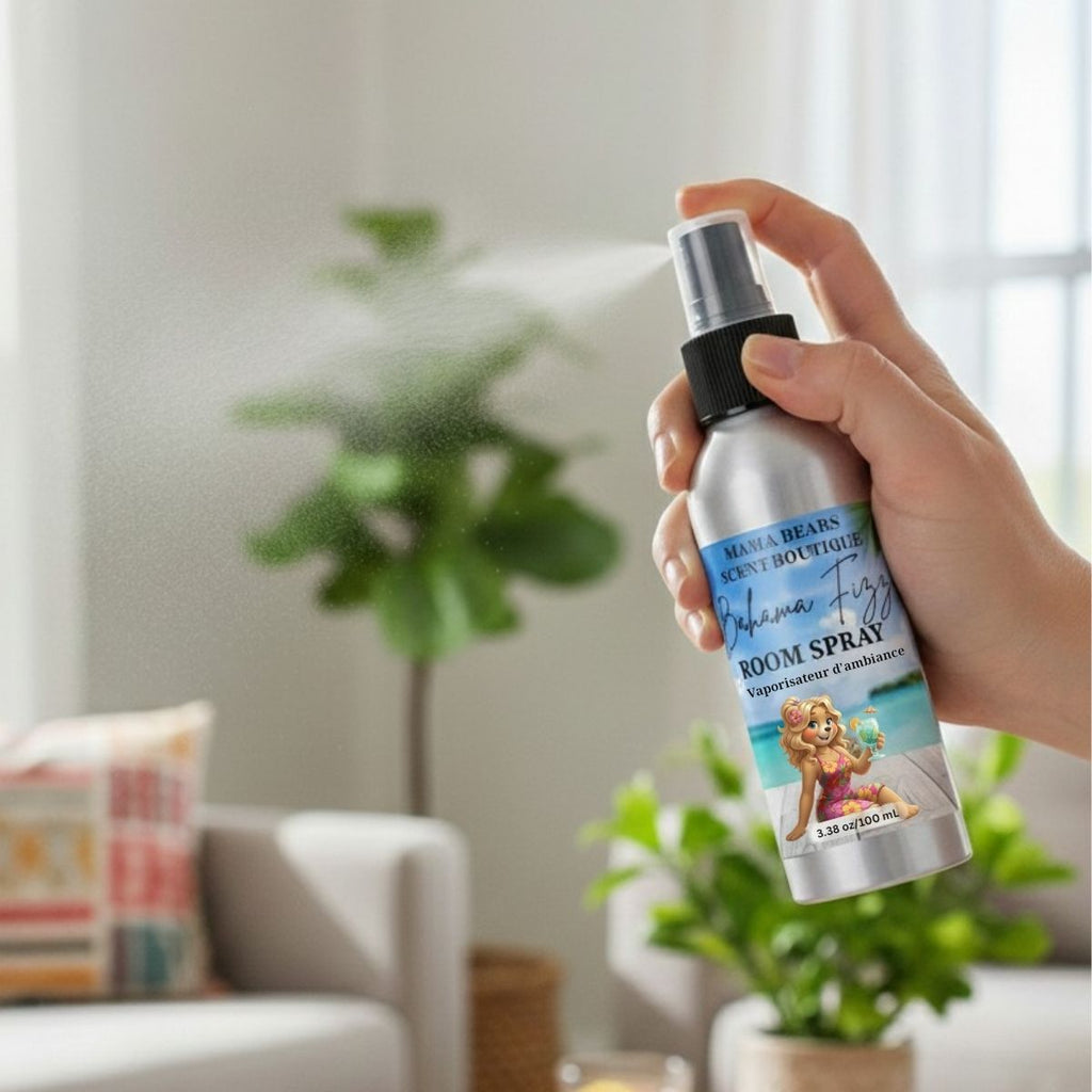 Hand holding a Bahama Fizz room spray bottle in a living room setting