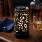 Wax melt wamer with bear design on a wooden surface with books and a glass of whiskey in the background.