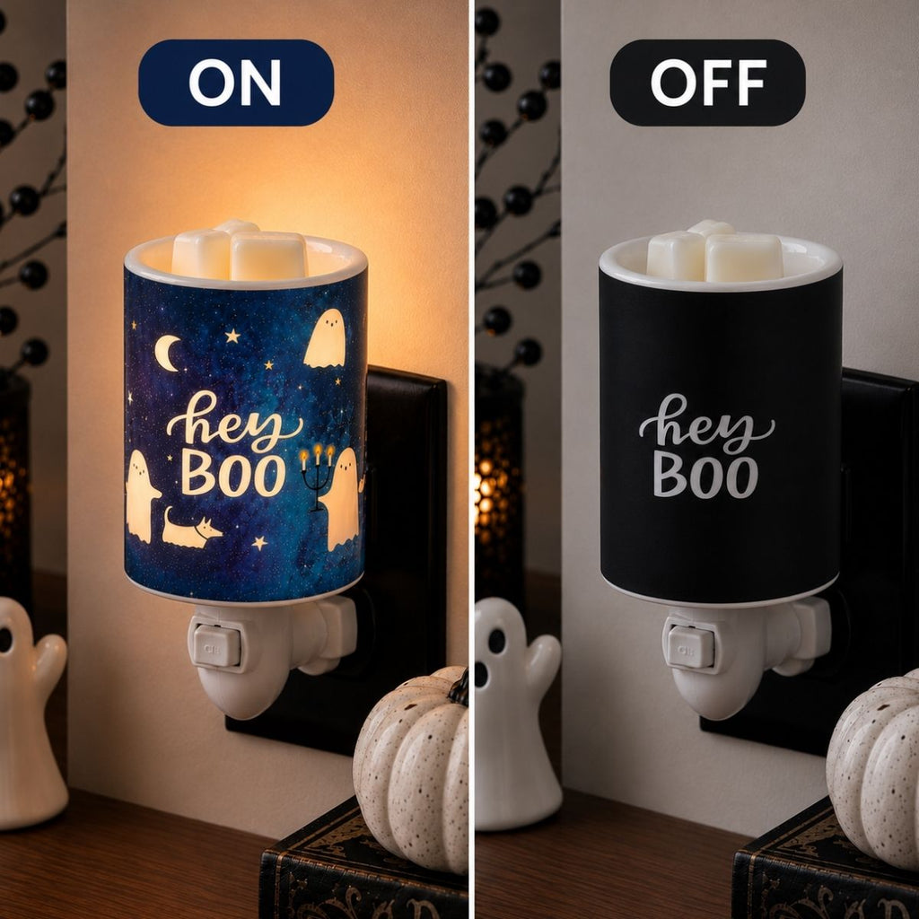 A split comparison showing a Halloween night light plug-in in two states: ON on the left, glowing with a blue starry sky and ghost design, and OFF on the right, showing the black interior. Both views are set in a home environment with a small pumpkin and ghost figurine.