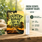 Air freshener with 'Country Roads Take Me Home' design and refreshing spray on a wooden surface.