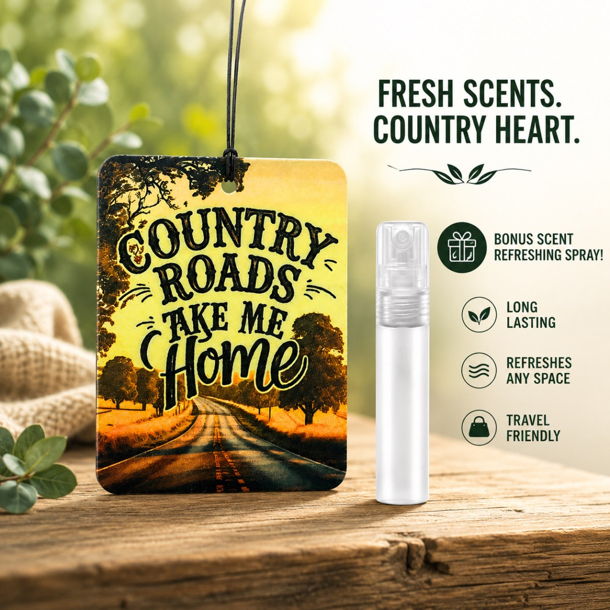 Air freshener with 'Country Roads Take Me Home' design and refreshing spray on a wooden surface.
