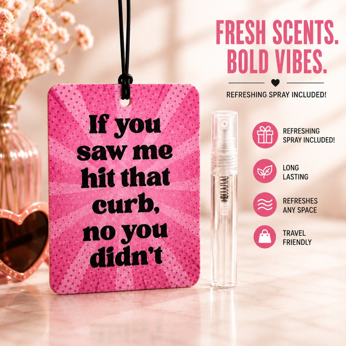Pink air freshener with humorous text and refreshing spray on a blurred background