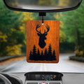 A Deer Silhouette image with a rustic wood background on a Felt Car Air Freshener. Hanging from a rear view window.