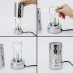 Step-by-step assembly of a wax warmer with a metallic base and glass shade.